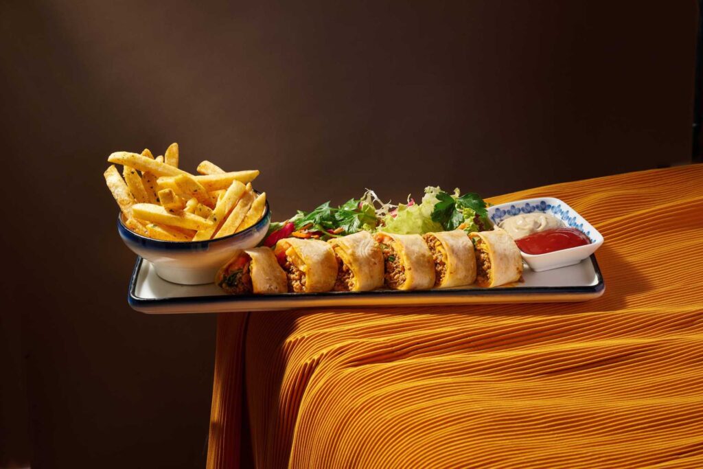 Tantuni – Turkish street food wrap filled with spiced beef, sumac onions, tomatoes, and parsley, served with ayran